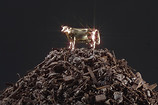 - 2010 – Scum of the Earth
Material: Slag from garbage incineration, brass, gold leaf Dimensions: 76 x 72 x 106 cm