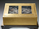 Privatsammlung, Viena, Austria, 2006 – Reliquary Casket No. 6
Material: Gold leaf, slag from garbage incineratioDimensions: 58 x 62 x 24 cm
 