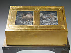 Integral Kulturstiftung, Maxhütte Haidhof, 2006 &ndash; Reliquary Casket No. 5
Material: Gold leaf, slag from garbage incinerationDimensions: 58 x 62 x 24 cm
&nbsp;